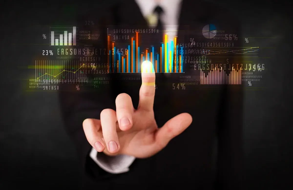 Business person touching colorful charts and diagrams-1