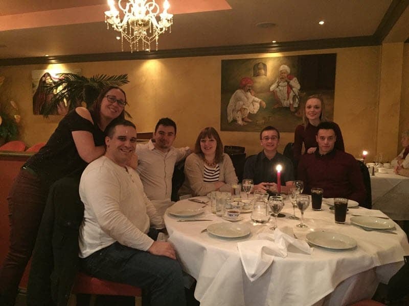 A photo of the Atlas Mapping team (and our partners) at our Christmas meal.
